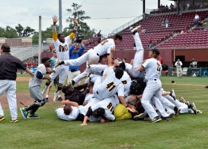 KSU players celebrate their 4-2 win over Alabama in the Tallahassee Regional on Sunday. The Owls will face Louisville this weekend with a chance to advance to the College World Series. (Photo: Special from KSU Athletics)