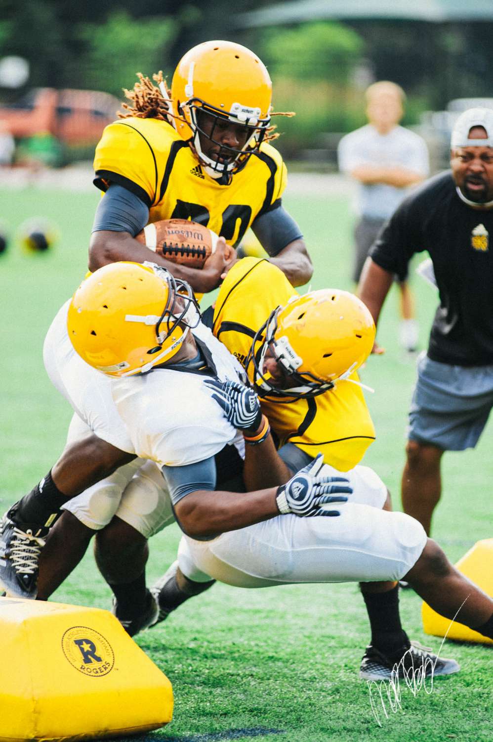 Football Players Show Intensity in First Full-Pad Practice
