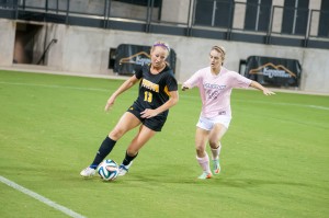 Sophomore Shannon Driscoll dribbles the ball passed a Stetson defender during Friday night's  2-1 victory. Photo by Matt Boggs.