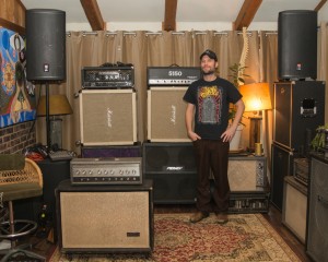 Aaron Hill standing in his recording room. Photo by Lou Raimondi.