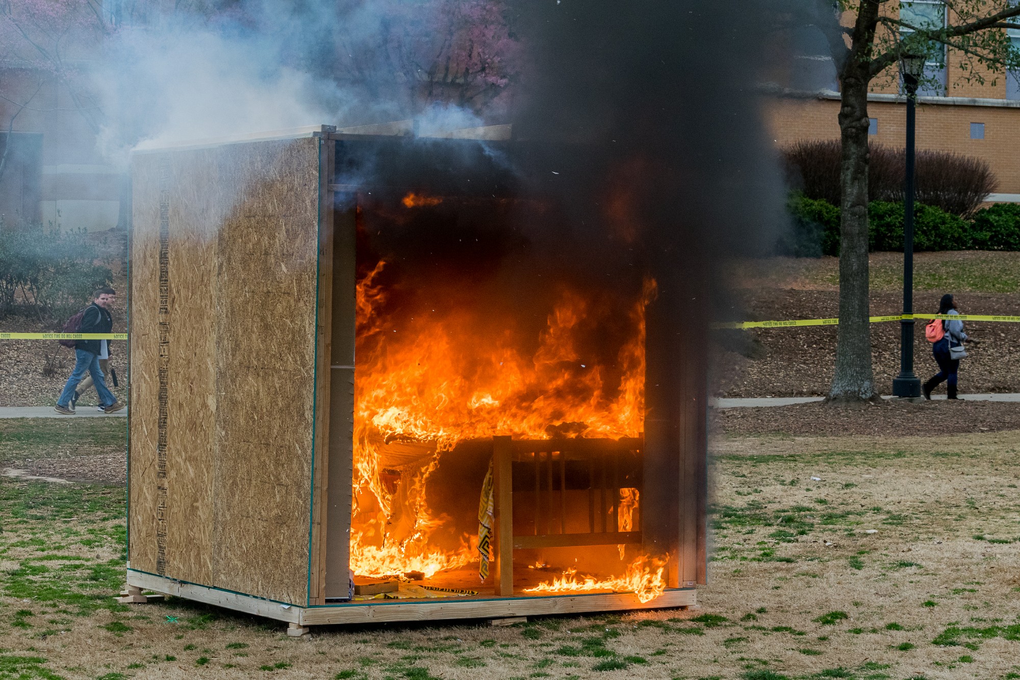 Campus officials burn mock dorm to promote fire safety