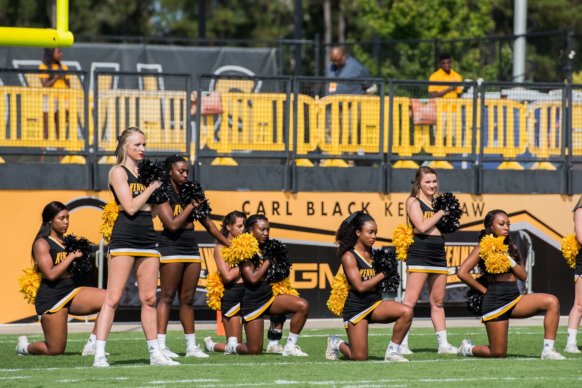Cheerleaders absent from field after kneeling during anthem