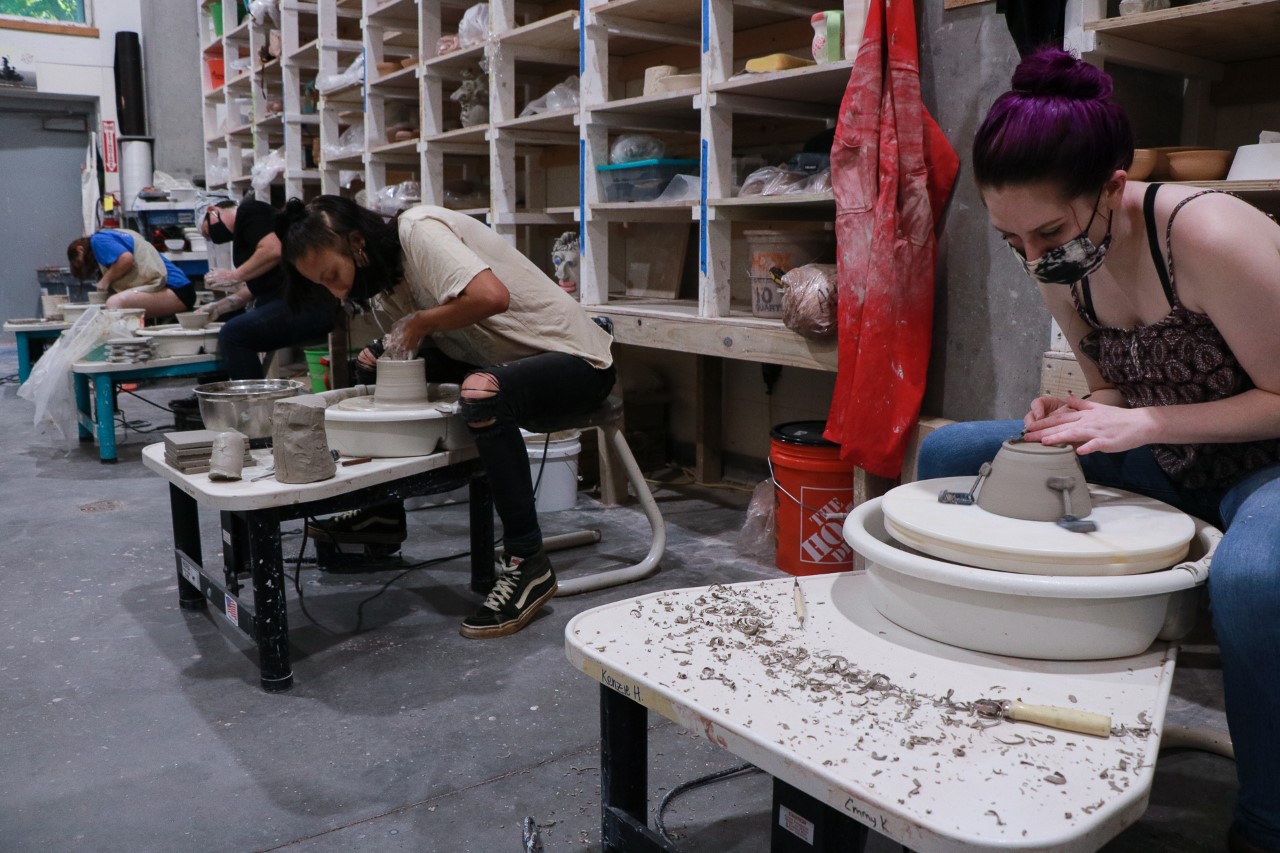 Students make bowls for the Empty Bowls event.