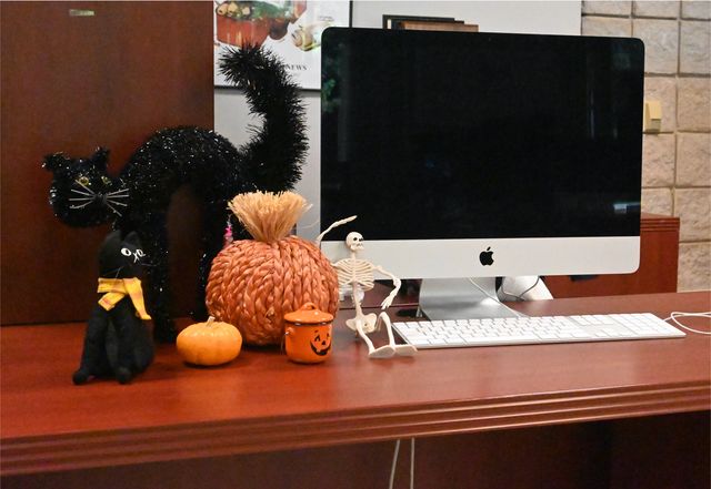 Halloween decorations placed on a desk in a KSU office.