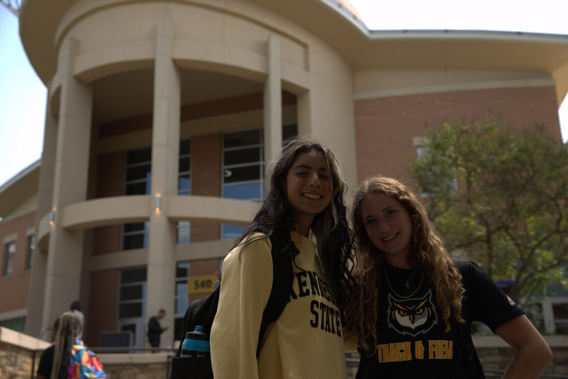 Aleena Ponto (Excercise Science) and Silvana Lopez Ramirez in front of the commens celebrating College Colors Day on the Kennesaw Campus.