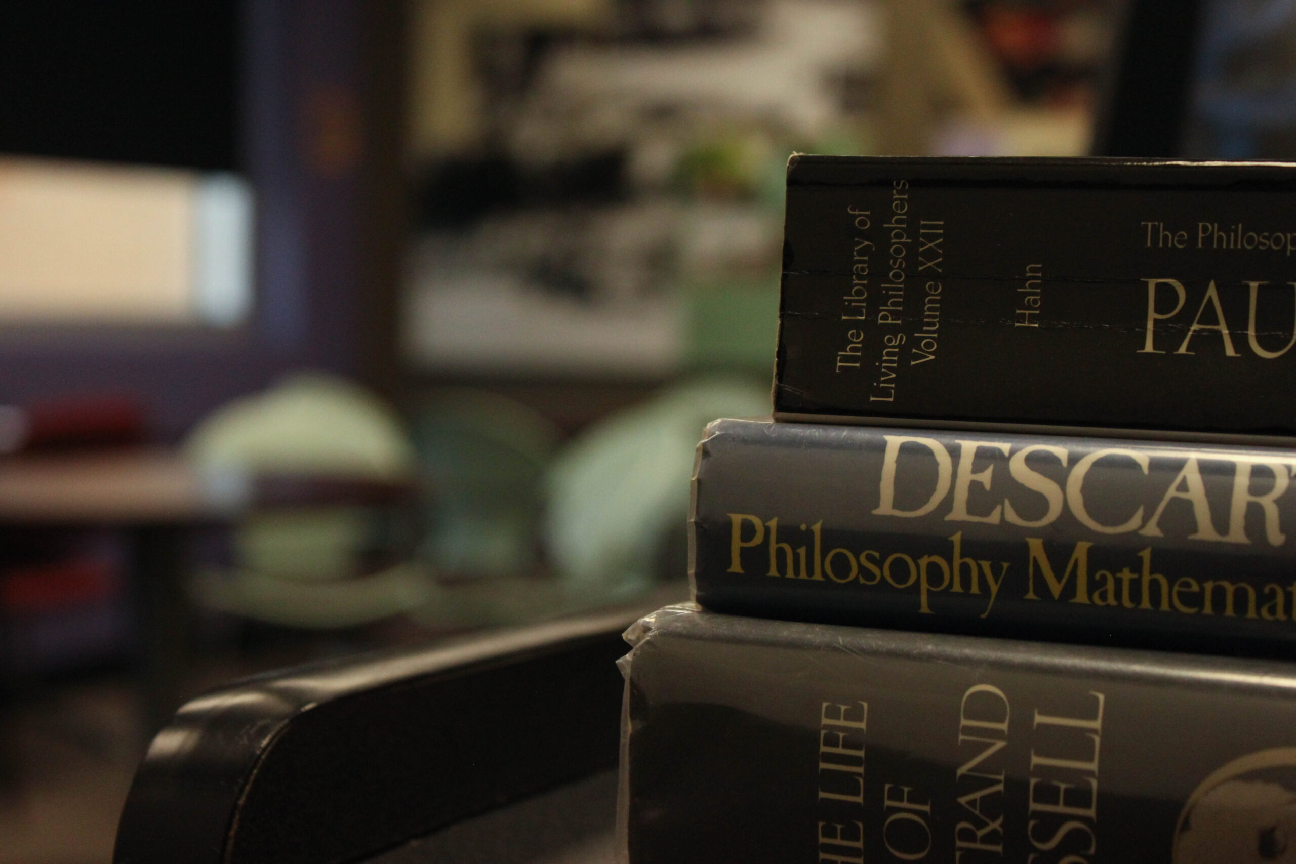 Stack of philosophy text books on a lectern.
